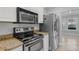 The kitchen has stainless steel appliances, granite countertops, and tile flooring at 1013 Inlet Way, Altamonte Springs, FL 32714