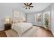 A spacious primary bedroom featuring a ceiling fan, a queen bed, and several windows at 1013 Inlet Way, Altamonte Springs, FL 32714