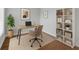 Bright home office features neutral carpet, bookshelves and modern furnishings at 1013 Inlet Way, Altamonte Springs, FL 32714
