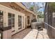 Enclosed patio with hot tub, tile flooring, and access through glass French doors at 1013 Inlet Way, Altamonte Springs, FL 32714