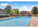 A refreshing community pool with plenty of lounge chairs, trees, and green landscaping for residents to enjoy at 1013 Inlet Way, Altamonte Springs, FL 32714