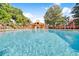 A serene community pool with access to a cabana surrounded by trees and lounge chairs for residents to enjoy at 1013 Inlet Way, Altamonte Springs, FL 32714