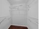 Empty walk-in closet with laminate wood flooring and wire shelving at 1013 Inlet Way, Altamonte Springs, FL 32714