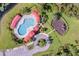 Aerial view of the pool and playground; a great spot for Gathering fun at 10143 Pink Carnation Ct, Orlando, FL 32825