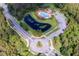 Community amenities include a pool with cabanas, pond and playground surrounded by lush landscaping at 10143 Pink Carnation Ct, Orlando, FL 32825