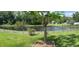 This backyard features a peaceful pond view and an iron fence at 10143 Pink Carnation Ct, Orlando, FL 32825