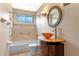 Bathroom features a decorative sink and shower/tub combo at 10143 Pink Carnation Ct, Orlando, FL 32825