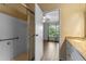 Bathroom featuring a shower, double sinks, and access to the main bedroom at 10143 Pink Carnation Ct, Orlando, FL 32825