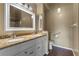 Bathroom featuring double sinks, granite counters, and a shower/tub combo at 10143 Pink Carnation Ct, Orlando, FL 32825