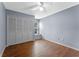 Bedroom boasts hardwood floors, neutral paint and ample closet space at 10143 Pink Carnation Ct, Orlando, FL 32825