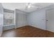 Bedroom features hardwood floors, neutral paint, and a closet at 10143 Pink Carnation Ct, Orlando, FL 32825