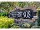 Elegant Cypress Springs community sign with manicured landscaping and mature trees at 10143 Pink Carnation Ct, Orlando, FL 32825