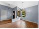Inviting foyer with a decorative front door, chandelier, and stylish wood flooring at 10143 Pink Carnation Ct, Orlando, FL 32825