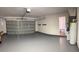 Clean two car garage with epoxy flooring and access to an interior space at 10143 Pink Carnation Ct, Orlando, FL 32825