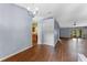 Spacious living room featuring wood flooring, natural light, and open floor plan at 10143 Pink Carnation Ct, Orlando, FL 32825