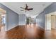 Bright and airy living room with hardwood floors, a ceiling fan, and an open layout at 10143 Pink Carnation Ct, Orlando, FL 32825