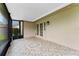 Covered patio featuring tile flooring, and a screened in section with backyard views at 10143 Pink Carnation Ct, Orlando, FL 32825