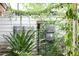 Backyard features a lush garden and ambient lighting at 11923 Lake Butler Blvd, Windermere, FL 34786