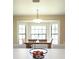View of dining table situated near a bay window, offering ample natural light at 11923 Lake Butler Blvd, Windermere, FL 34786