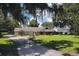 Charming single-story home with a lush green lawn and mature trees, offering a serene and inviting curb appeal at 11923 Lake Butler Blvd, Windermere, FL 34786