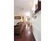 Hallway with hardwood floors, and a wine rack creating a seamless flow between rooms at 11923 Lake Butler Blvd, Windermere, FL 34786