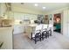 Well-lit kitchen featuring a central island with white countertops and seating for four at 11923 Lake Butler Blvd, Windermere, FL 34786
