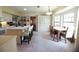 Spacious eat-in kitchen with a central island, adjacent dining table, and ample storage at 11923 Lake Butler Blvd, Windermere, FL 34786