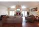 Cozy living room with vaulted ceilings, hardwood floors, and a fireplace, creating a comfortable and inviting space at 11923 Lake Butler Blvd, Windermere, FL 34786