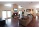 Inviting living room featuring a cozy fireplace, hardwood floors, and ample natural light, creating a warm and welcoming atmosphere at 11923 Lake Butler Blvd, Windermere, FL 34786