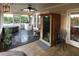 Enclosed porch including a sauna, seating and a view of the yard at 11923 Lake Butler Blvd, Windermere, FL 34786
