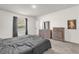 Nicely furnished bedroom with two dressers and neutral walls at 123 Zinnia W Ln, Poinciana, FL 34759