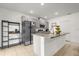 Well-lit kitchen features a breakfast bar, stainless steel appliances, and functional layout at 123 Zinnia W Ln, Poinciana, FL 34759