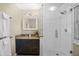 Stylish bathroom featuring a glass-enclosed shower and granite vanity at 125 W Wyndham Ct, Longwood, FL 32779