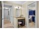 Bathroom vanity area with granite countertop and access to a walk-in closet at 125 W Wyndham Ct, Longwood, FL 32779