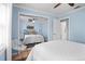 Serene bedroom featuring a mirrored closet and ensuite bathroom entrance at 125 W Wyndham Ct, Longwood, FL 32779
