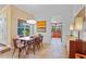 Sunlit dining room with wooden table, chairs, and a large window offering natural light at 125 W Wyndham Ct, Longwood, FL 32779
