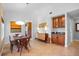 Bright dining room featuring a wooden table, chairs, and built-in cabinet with glass doors at 125 W Wyndham Ct, Longwood, FL 32779