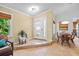 Welcoming foyer leads to dining area, complete with tile floors and modern decor at 125 W Wyndham Ct, Longwood, FL 32779