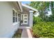 Inviting entrance with decorative plants and lush landscaping at 125 W Wyndham Ct, Longwood, FL 32779