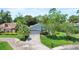 A charming home with lovely landscaping and a well-maintained yard at 125 W Wyndham Ct, Longwood, FL 32779