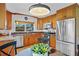 Charming kitchen with stainless appliances, granite counters, and ample cabinet space and eat in nook at 125 W Wyndham Ct, Longwood, FL 32779