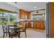 Cozy kitchen featuring wooden cabinets, granite countertops, and stainless steel appliances at 125 W Wyndham Ct, Longwood, FL 32779