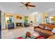 Cozy living room featuring a fireplace, tile flooring, and ample natural light at 125 W Wyndham Ct, Longwood, FL 32779