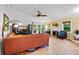 Inviting living room complete with a cozy fireplace, tile floors and backyard access at 125 W Wyndham Ct, Longwood, FL 32779