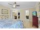 Spacious main bedroom with en-suite bathroom, walk-in closet, and access to outdoor area at 125 W Wyndham Ct, Longwood, FL 32779