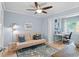Comfortable office space featuring a couch, desk, and ceiling fan at 125 W Wyndham Ct, Longwood, FL 32779