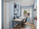 Bright office space with a view, desk, chair, computer and built-in shelving at 125 W Wyndham Ct, Longwood, FL 32779