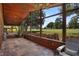 Relaxing sunroom featuring a hot tub, wood paneled walls and ceilings, and views of the golf course at 125 W Wyndham Ct, Longwood, FL 32779