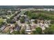 Wide aerial view of the neighborhood with nearby shops, restaurants, and highway at 13169 Odyssey Lake Way, Orlando, FL 32826