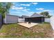 Backyard featuring a patio, chairs, and a shed, providing a relaxing outdoor space at 13169 Odyssey Lake Way, Orlando, FL 32826